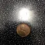 I have a 1944 wheat penny that sticks to a magnet. It also has a rim around it. Do you think it is worth anything?